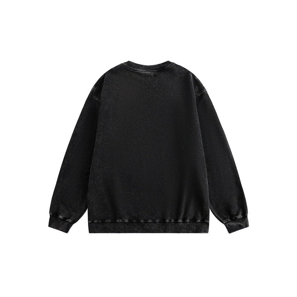 Back view of a plain black long-sleeve crewneck sweatshirt with ribbed cuffs and hem.