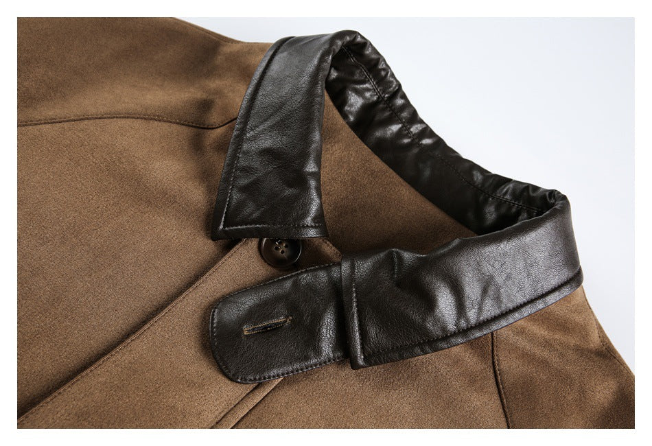 Close-up of the jacket's dark contrasting collar and button tab against tan-brown fabric.