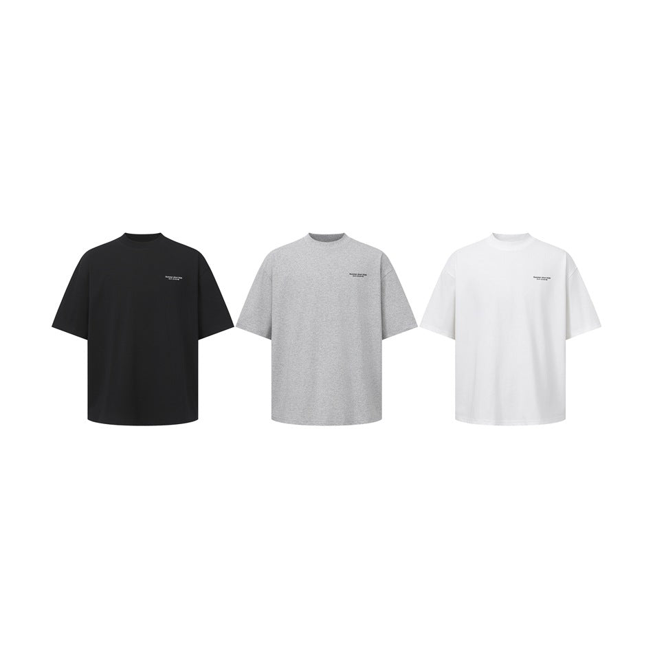 Three short-sleeve crew-neck T-shirts shown front-on in black, light gray, and white.