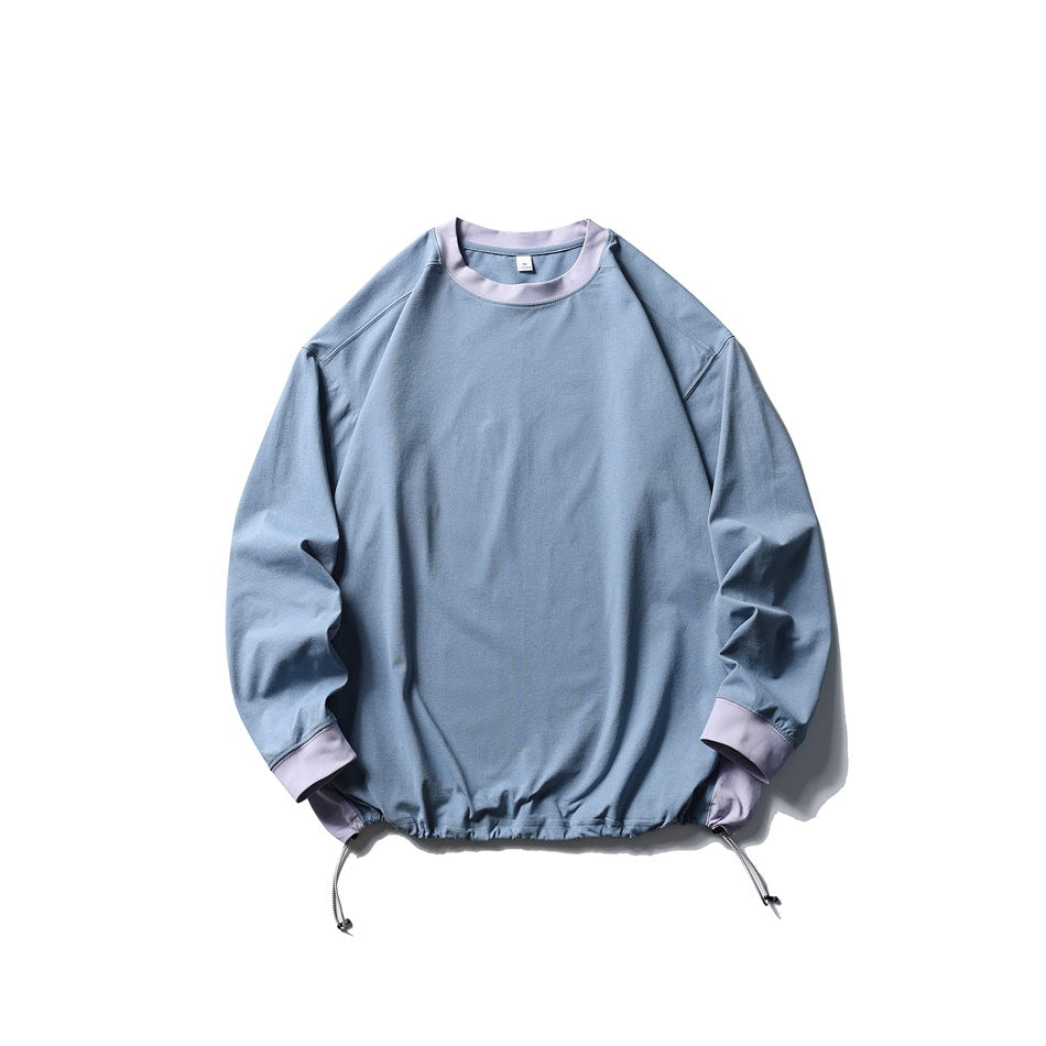 Blue crewneck pullover with lilac ribbed collar and cuffs and drawcord hem, flat lay