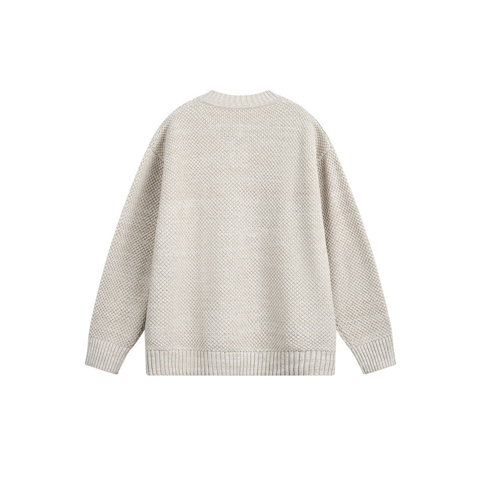 Back view of an oatmeal textured knit sweater with a ribbed crew neckline, cuffs and hem.
