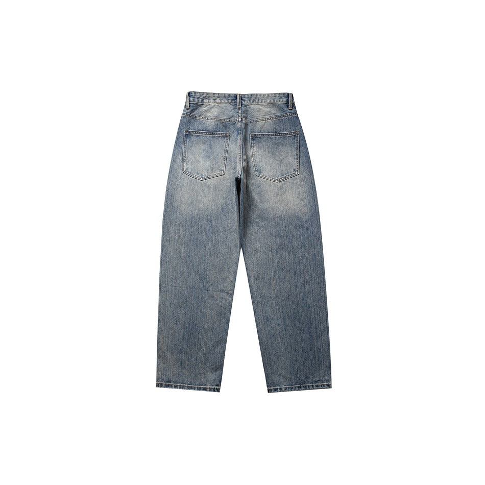 Back view of washed blue straight-leg jeans showing two patch pockets and faded denim finish on a white background