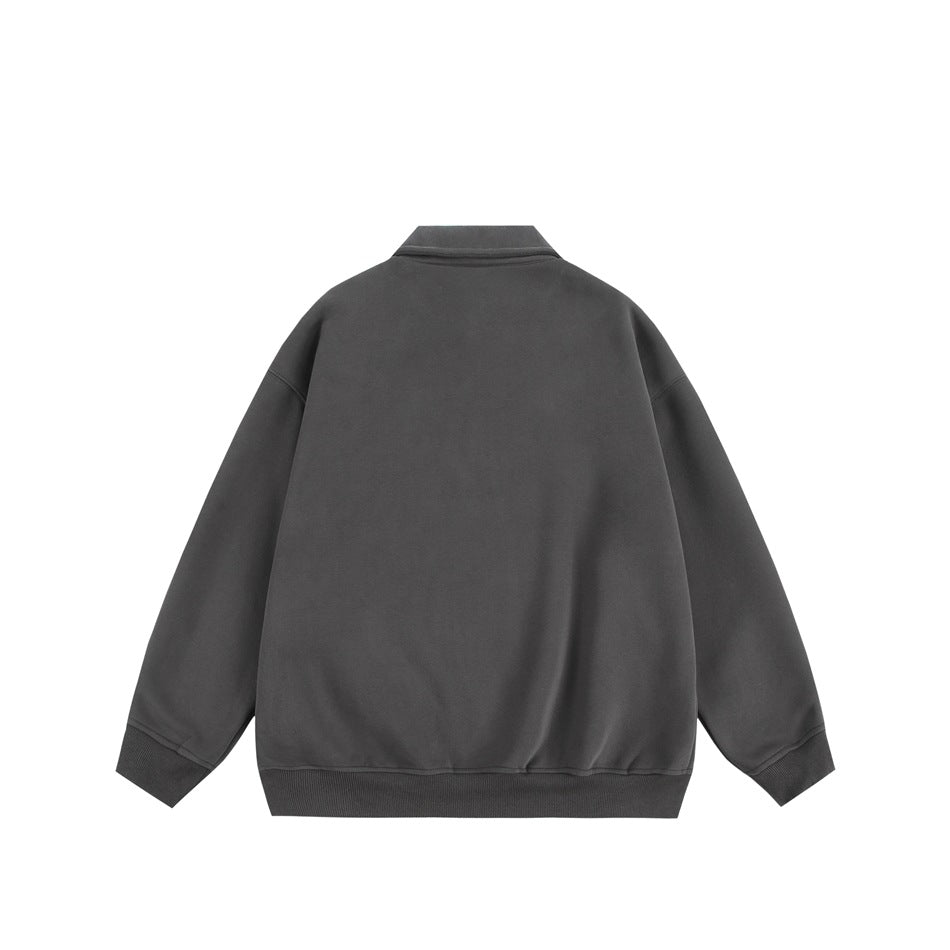 Back view of a charcoal-gray collared pullover with long sleeves and ribbed cuffs and hem.