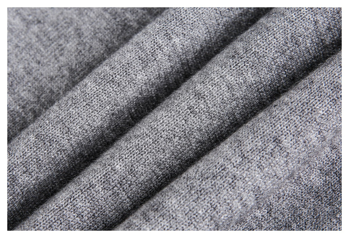 Macro view of the heather gray knit fabric draped in soft folds.