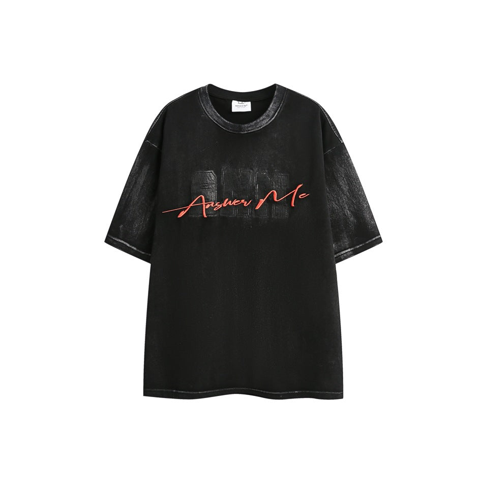 Black washed short-sleeve crew-neck T-shirt with red Answer Me script embroidery over a tonal ANM patch