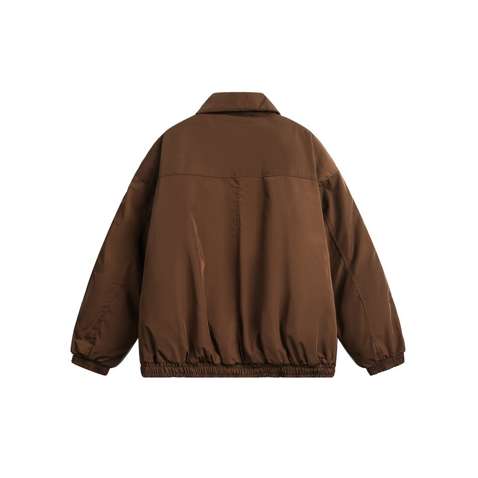 Back view of a brown jacket with a fold-down collar, loose sleeves, and elasticated cuffs and hem on white.