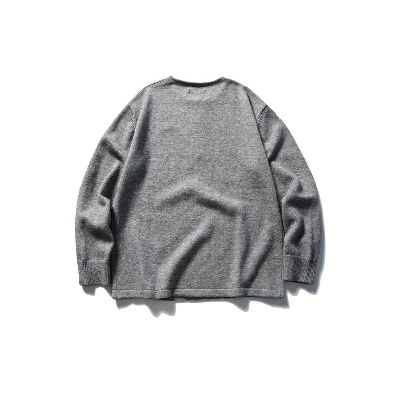 Back view of a plain gray long-sleeve knit top with ribbed cuffs.