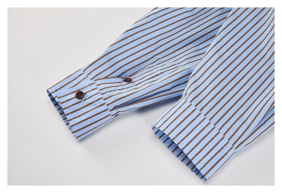 Close-up of two striped shirt sleeves with wide buttoned cuffs on a white background.