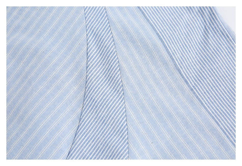 Close-up of light blue and white striped shirt panels with stripes running in different directions.