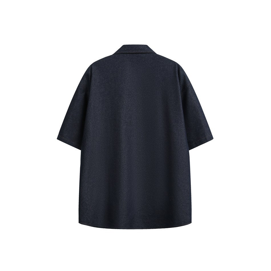 Back view of a dark blue short-sleeve shirt with a plain back, pointed collar and dropped shoulders