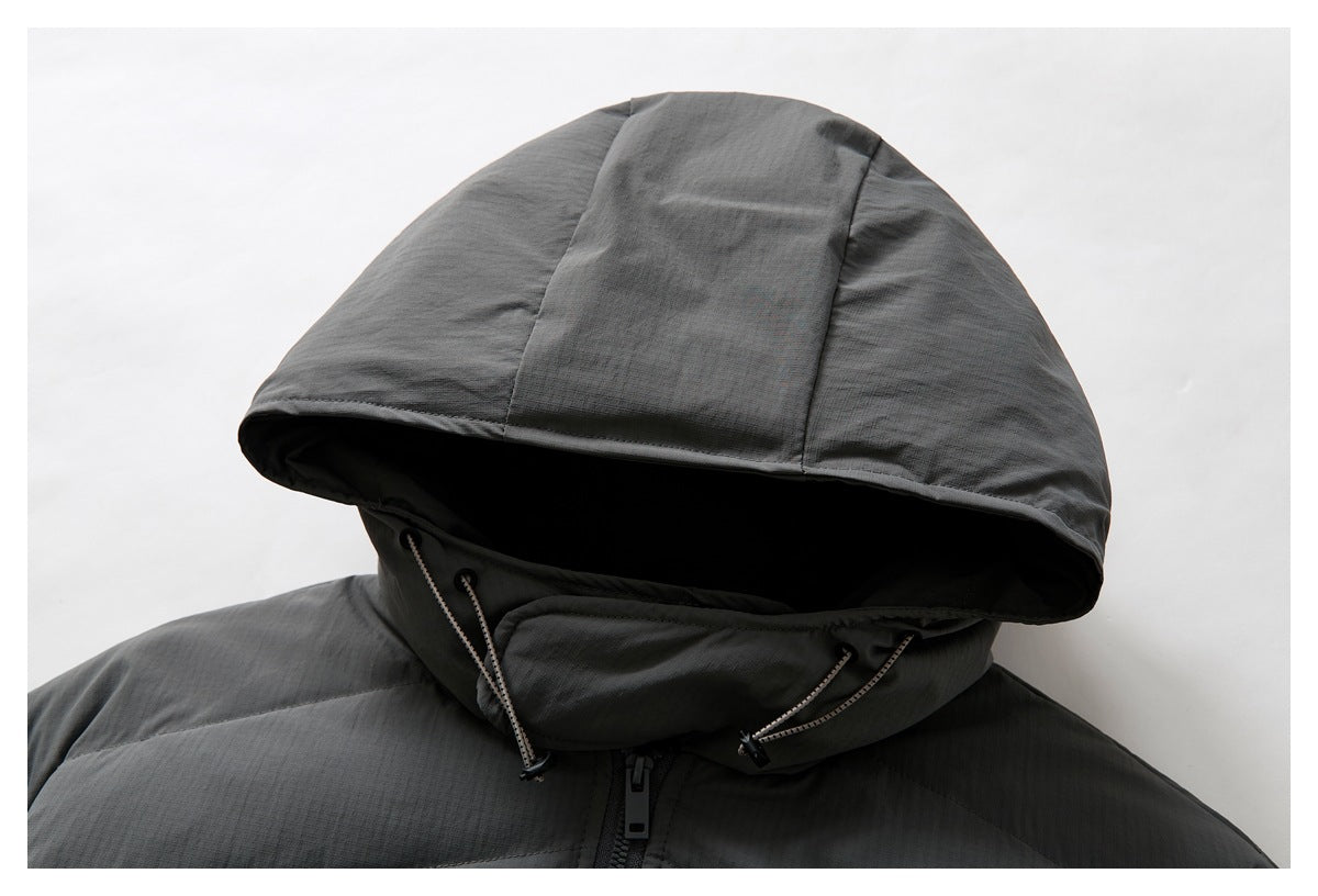 Close-up of a charcoal gray jacket hood with adjustable drawcords and a high collar.