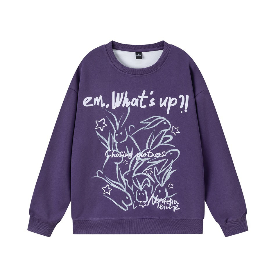Purple crew-neck sweatshirt with rabbit and star graphic and "em. What's up?!" text, flat front view