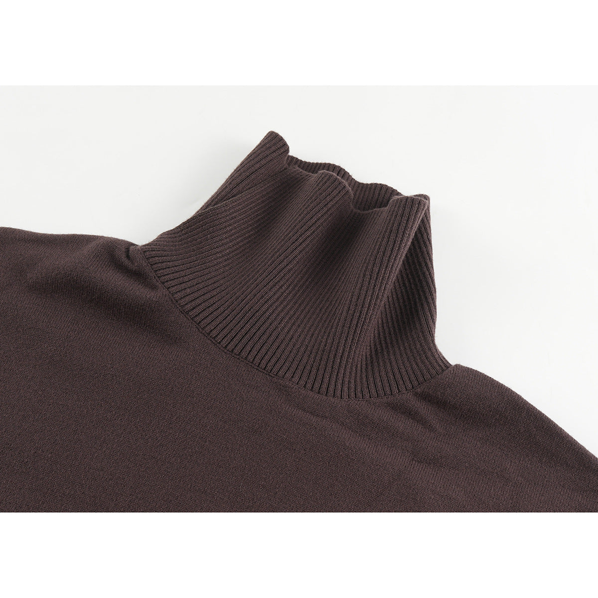 Close-up of a dark brown knit sweater's tall ribbed collar and upper body.