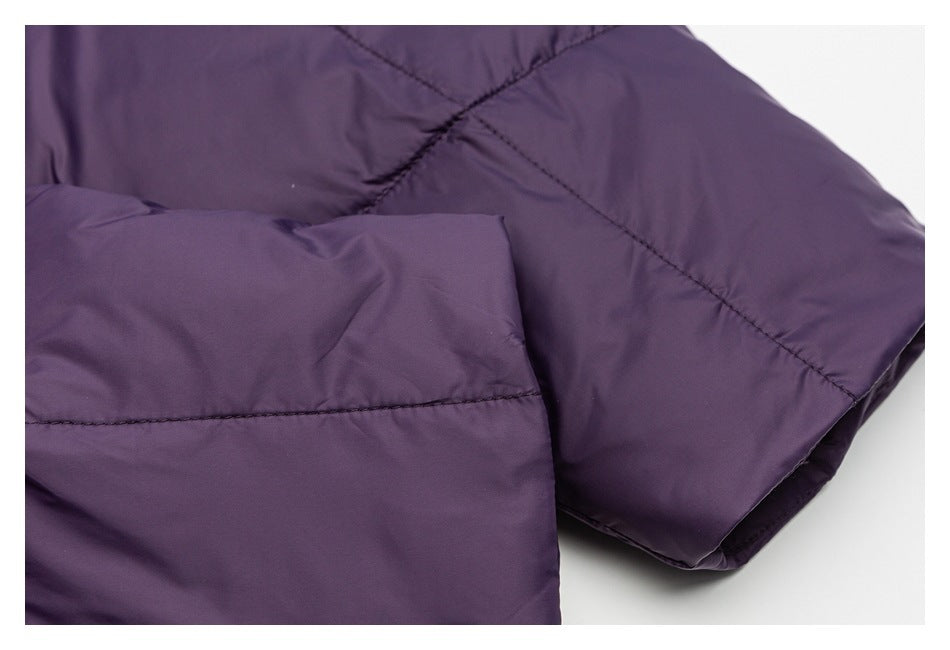 Close-up of the deep purple jacket's padded sleeve and stitched cuff.