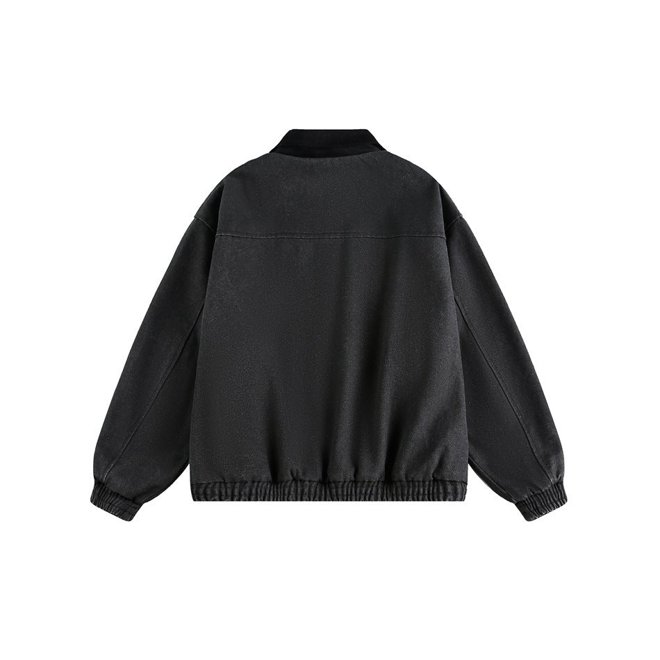 Back view of a black zip-up jacket with a matching collar and elastic cuffs and hem, on white.