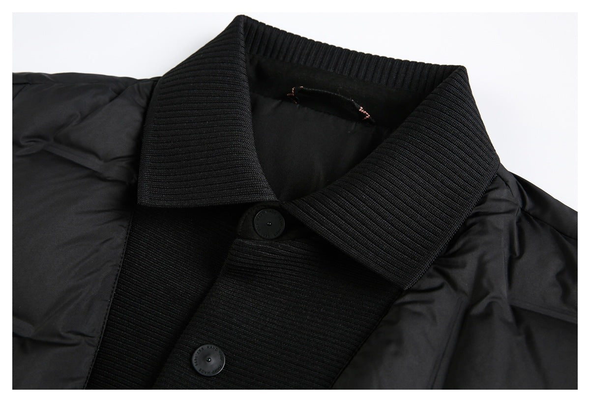 Close-up of a black jacket's wide ribbed collar, front placket, and buttons.
