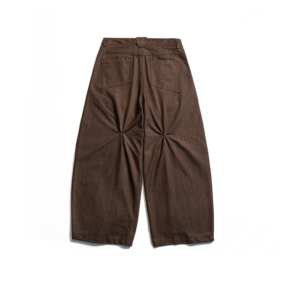 Brown wide-leg pants back view with patch pockets and pinched knee pleats