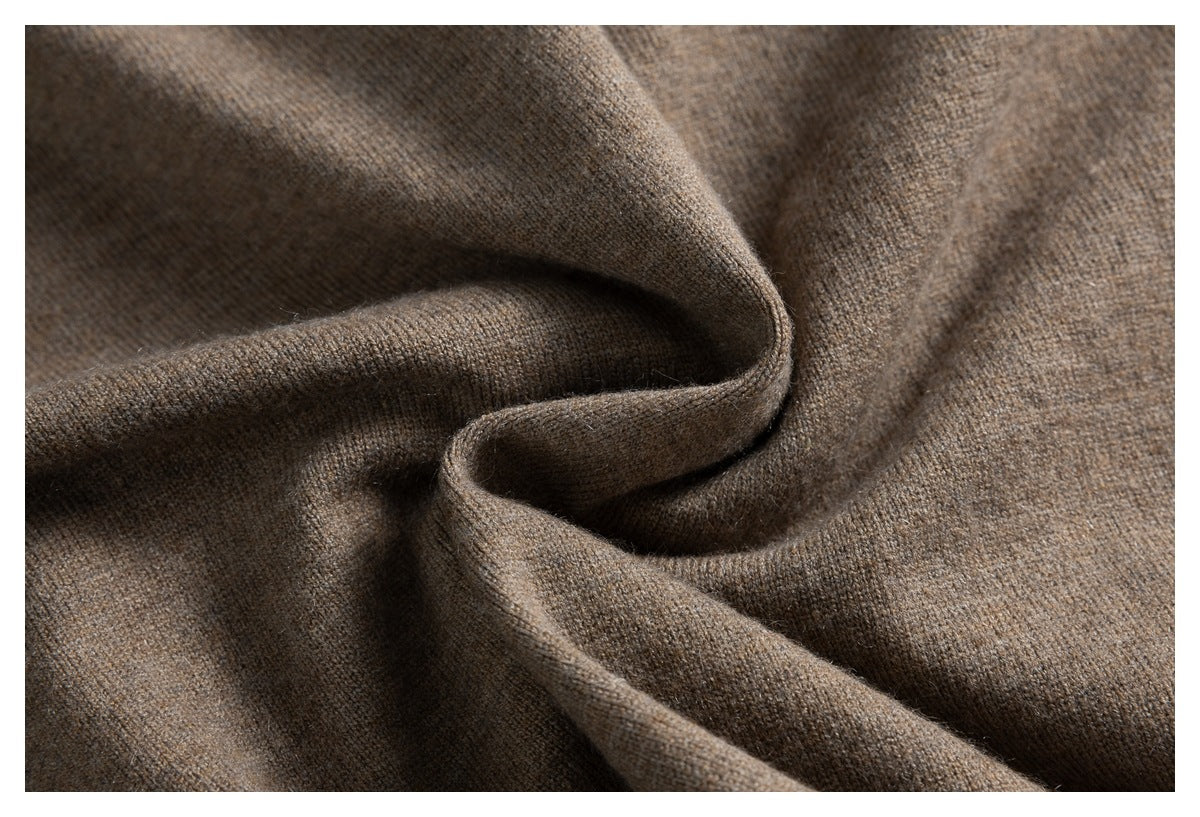 Close-up showing the soft-looking taupe knit fabric folded into loose folds.