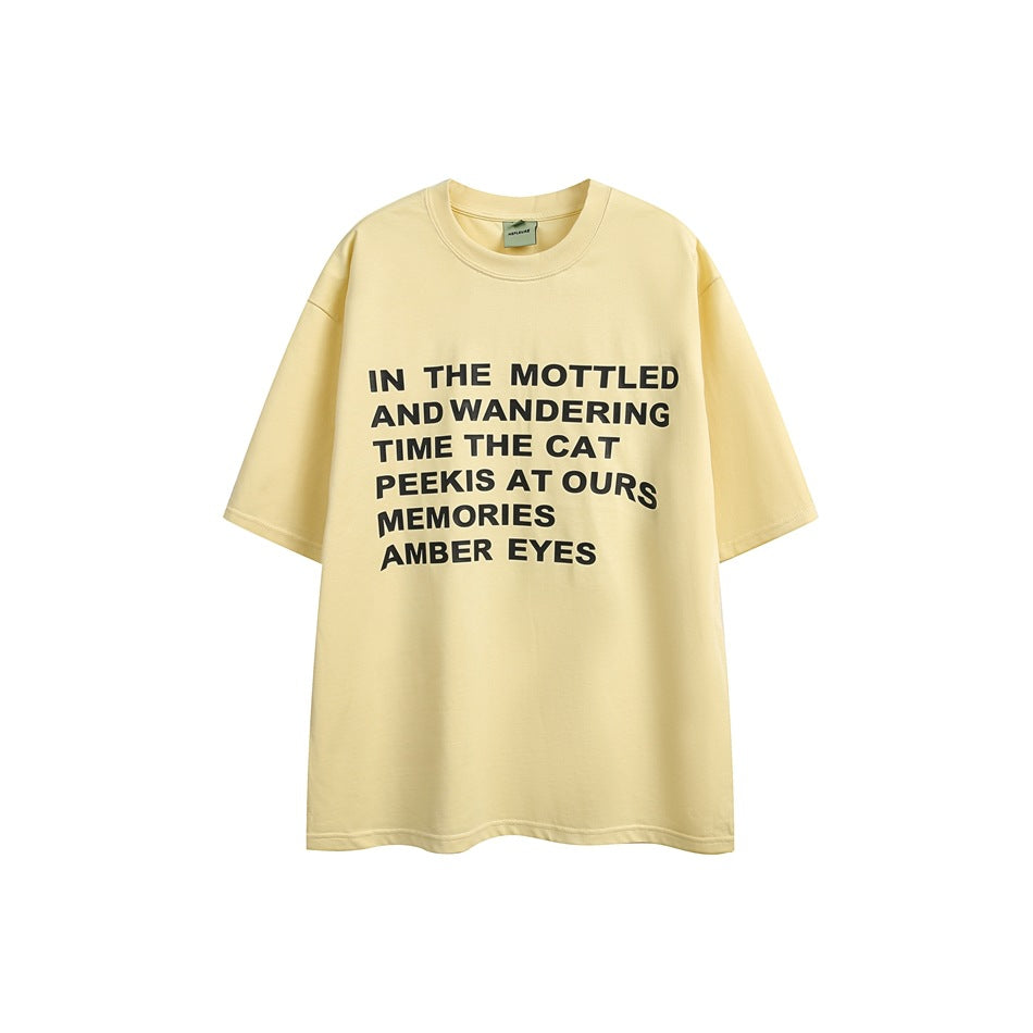 Light yellow short-sleeve crew-neck T-shirt, front view with black block-letter text print