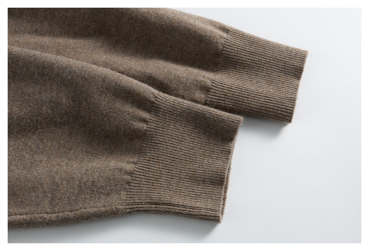 Close-up of the taupe cardigan's long sleeves and ribbed cuffs.