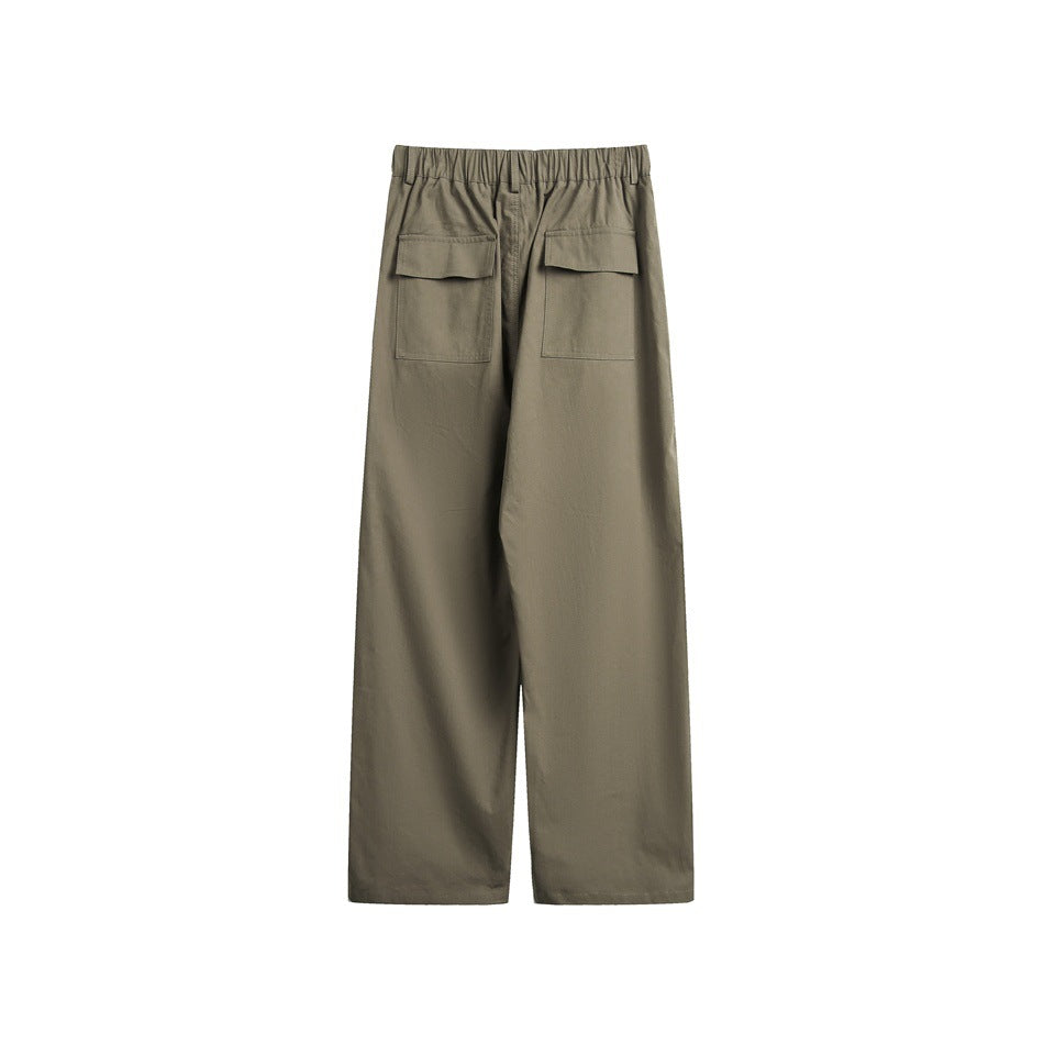 Back view of olive-green wide-leg trousers with an elasticated waistband and two flap-covered patch pockets.