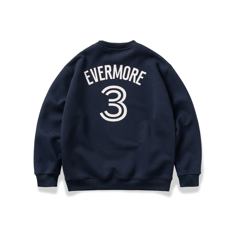 Back view of a navy crewneck sweatshirt laid flat, printed with white arched lettering and a large number 3.