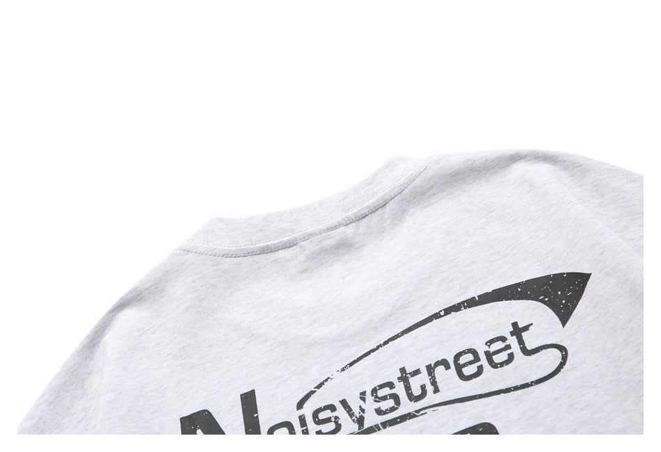 Close-up of a black printed graphic on the upper back of a light gray heathered garment.