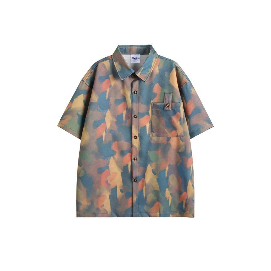 Blue multicolor abstract print short-sleeve button-up shirt with chest pocket, flat front view