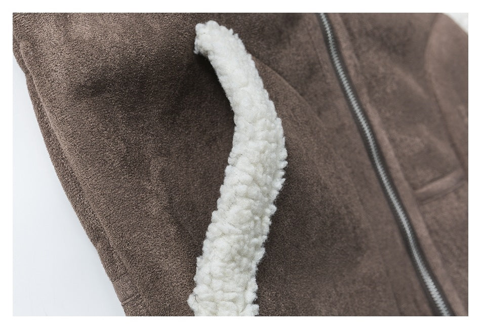 Close-up showing cream fleece trim along a brown jacket seam beside the front zipper.