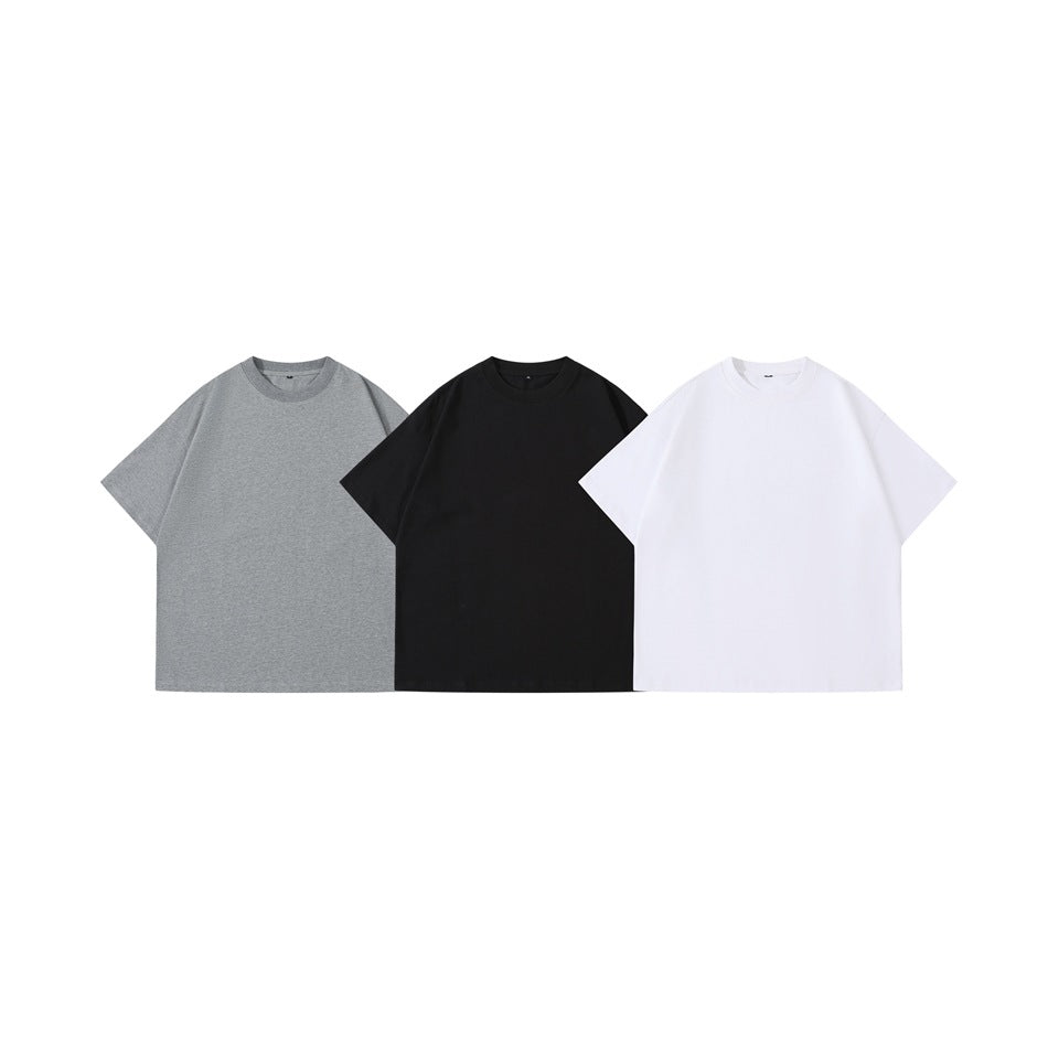 Three plain short-sleeve crew-neck T-shirts shown from the front in gray, black, and white.