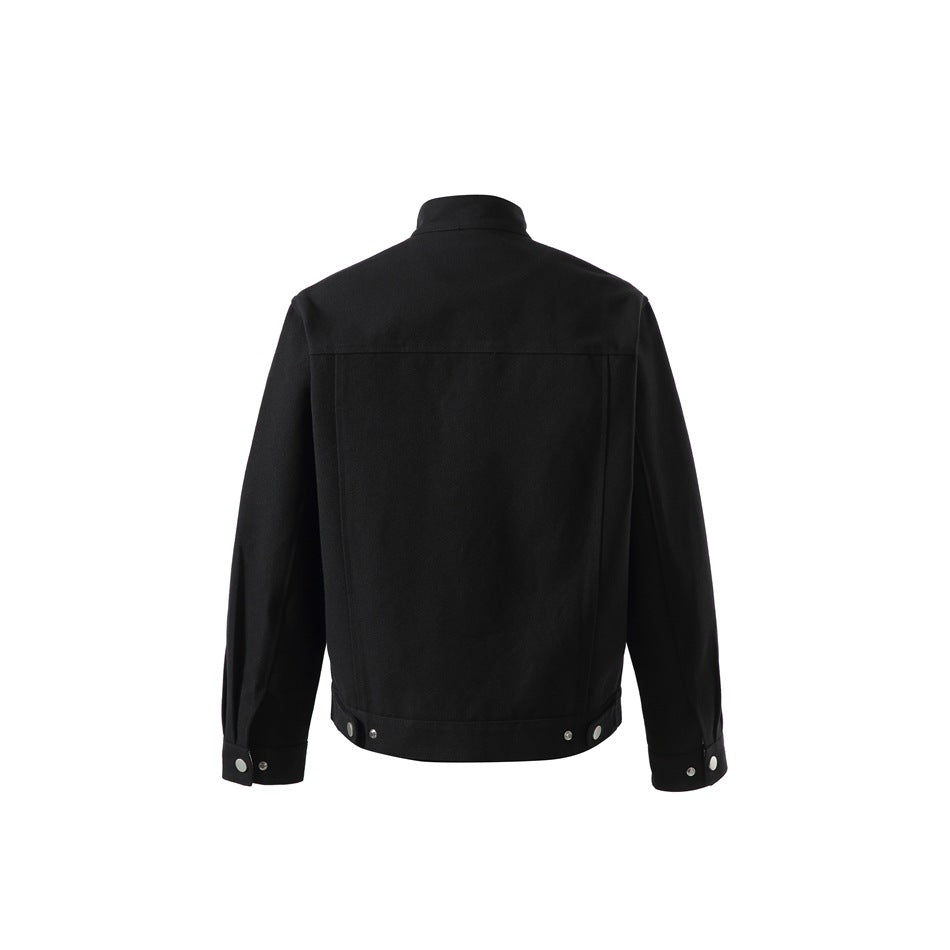 Back view of a black stand-collar jacket with a plain panel, snap-fastened cuffs, and hem details.
