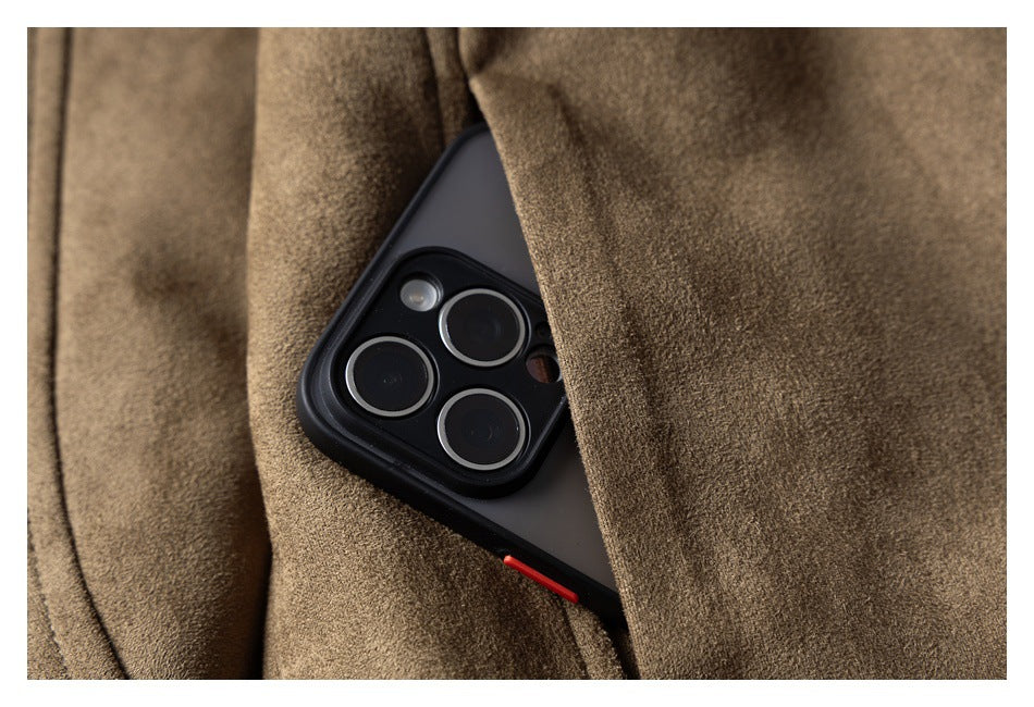 Close-up of a taupe-brown coat pocket holding a smartphone.