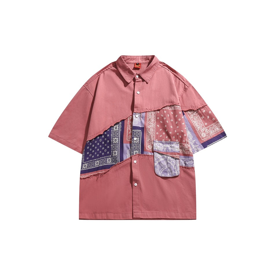 Red short-sleeve button shirt with diagonal purple and red bandana-paisley patchwork panel and flap pocket, front view