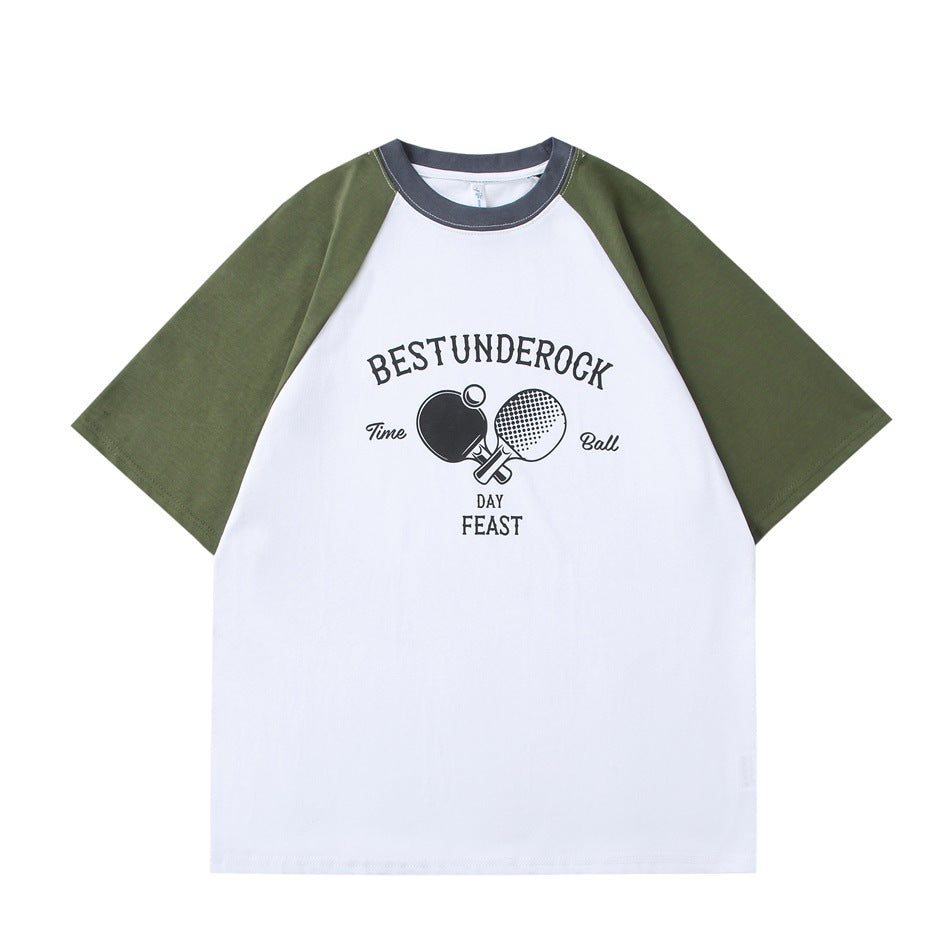 White raglan T-shirt with green sleeves, dark gray collar and a front table tennis paddle graphic