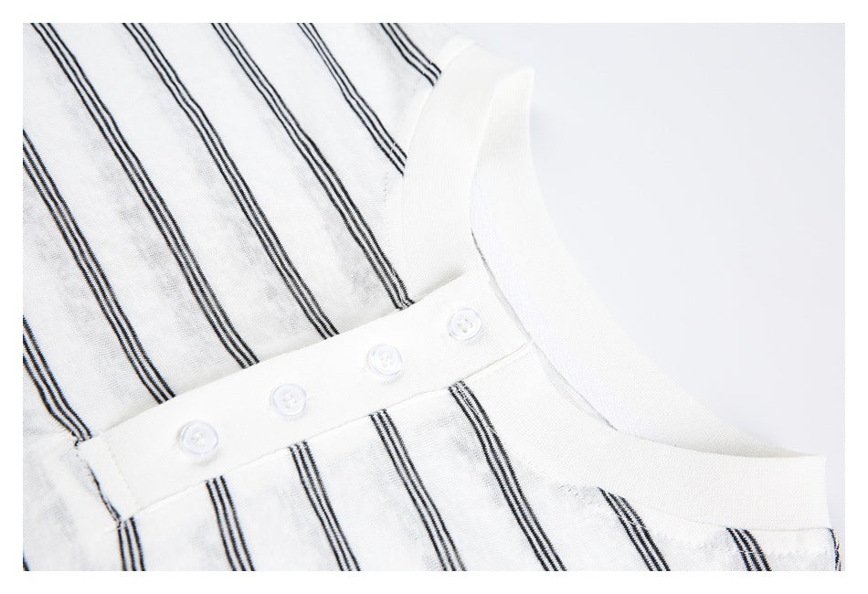Close-up of the white collar and four-button placket on a shirt with dark stripes.