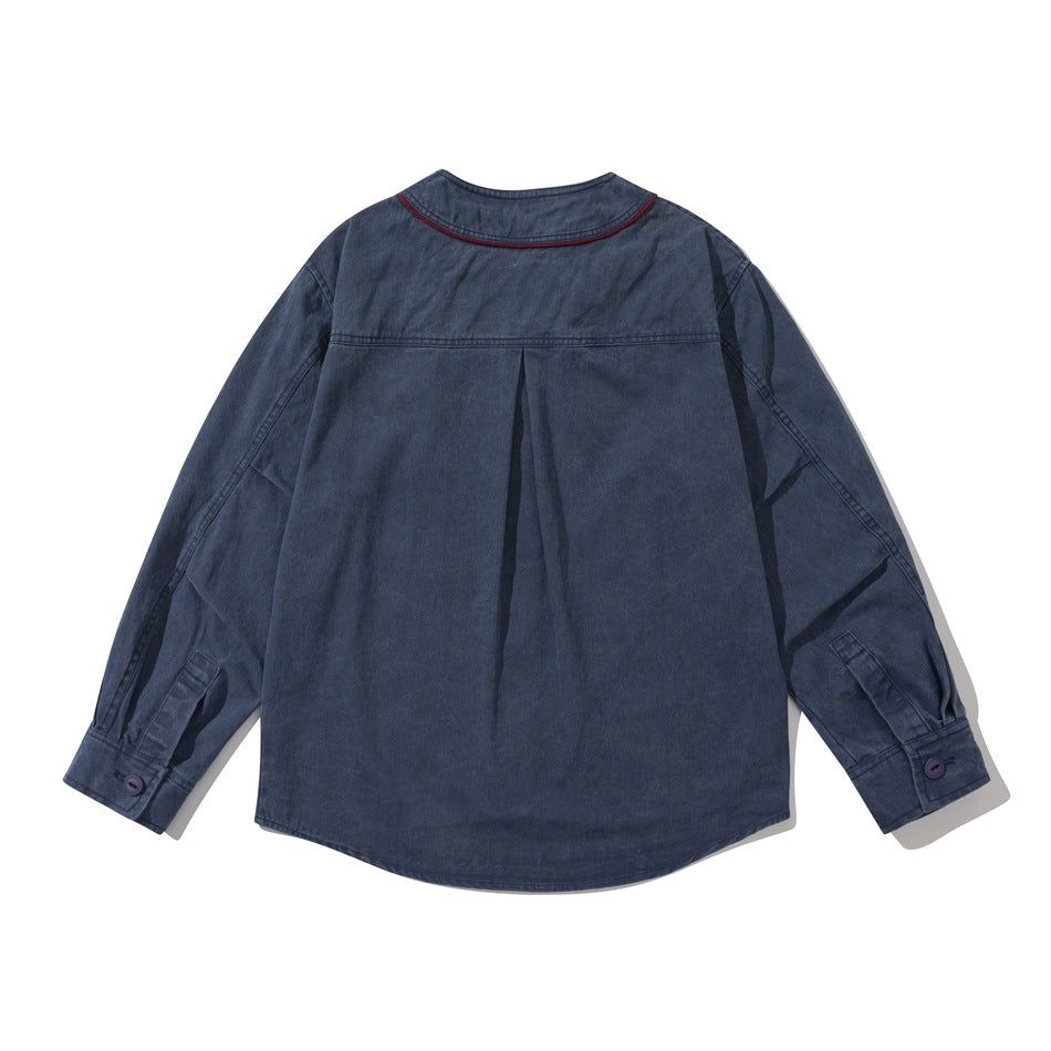 Back view of a navy long-sleeve shirt with burgundy piping around the collar and a center back pleat.