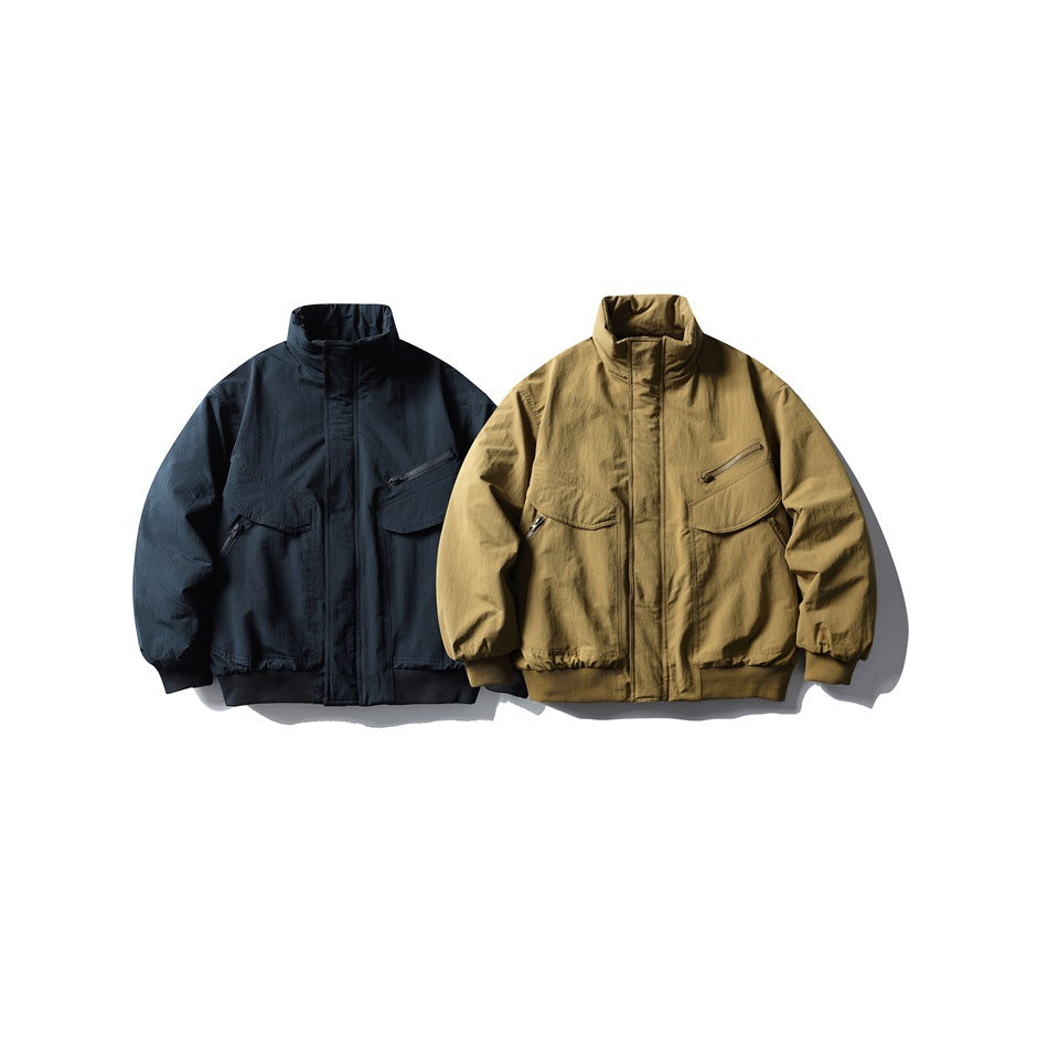 Front view of two jackets: one navy and one tan, with stand collars and multiple pockets.
