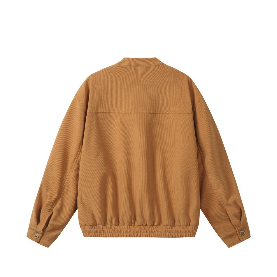 Back view of a tan ribbed jacket with long sleeves, buttoned cuffs, and an elasticated hem.