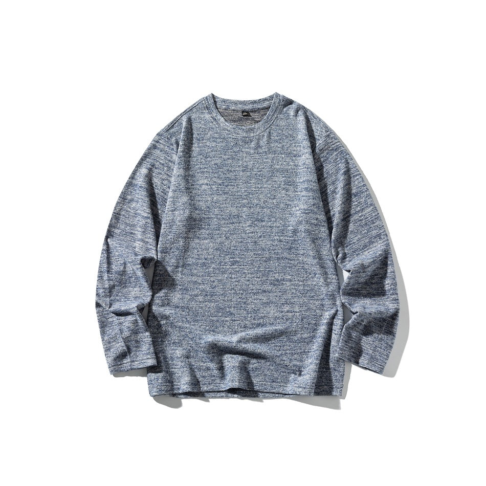Blue heathered knit long-sleeve crew-neck top laid flat, front view