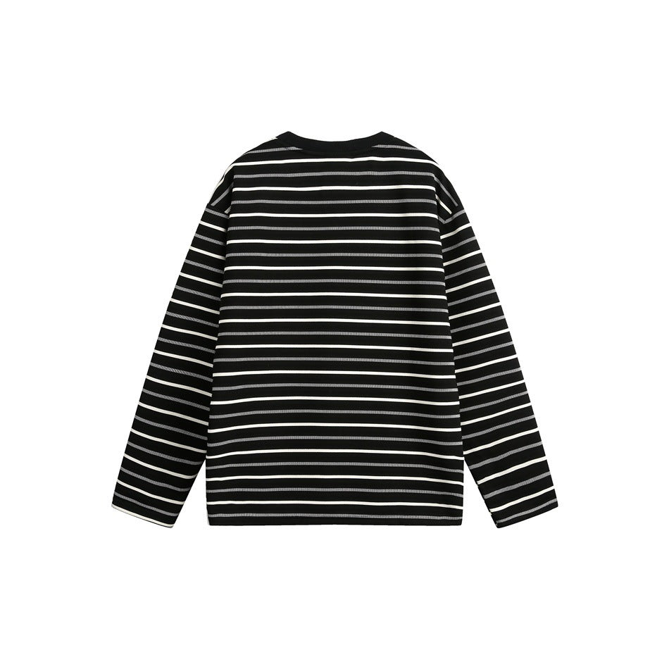 Back view of a black long-sleeve crewneck top with thin horizontal white stripes.