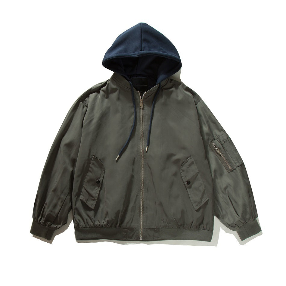 Dark gray zip-up bomber jacket with navy hood, drawstrings, flap pockets and sleeve zip pocket, flat lay front view