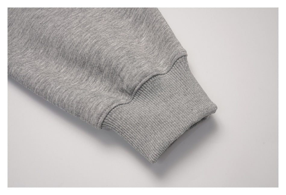Close-up of a ribbed cuff on the heather gray pullover sleeve.