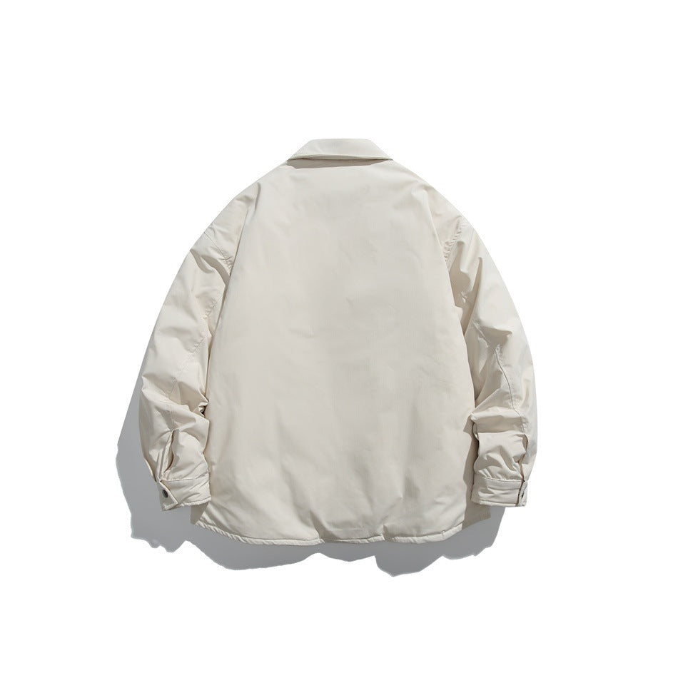 Back view of a light cream collared jacket with long sleeves and buttoned cuffs, shown flat against white.