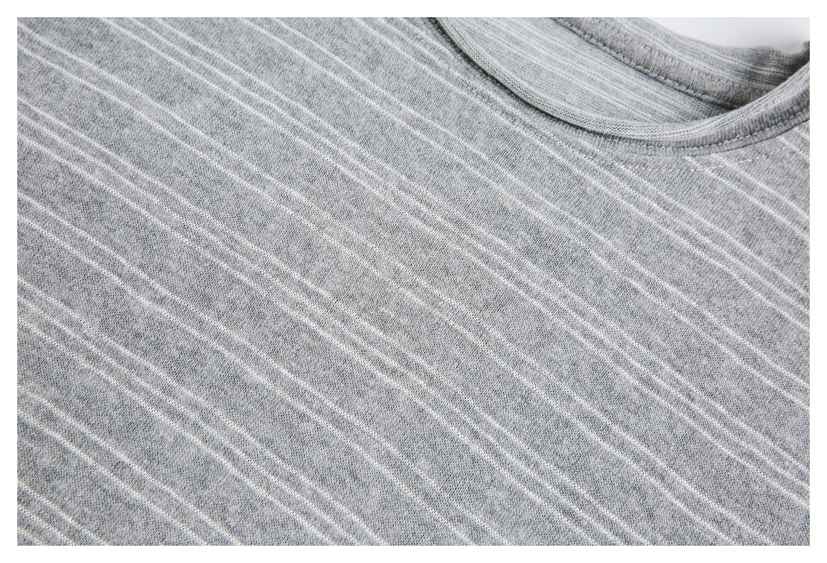 Close-up of the neckline and striped chest area of a heather gray top.