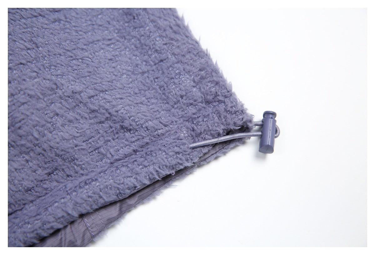Close-up of the vest hem with a cord and toggle adjuster.