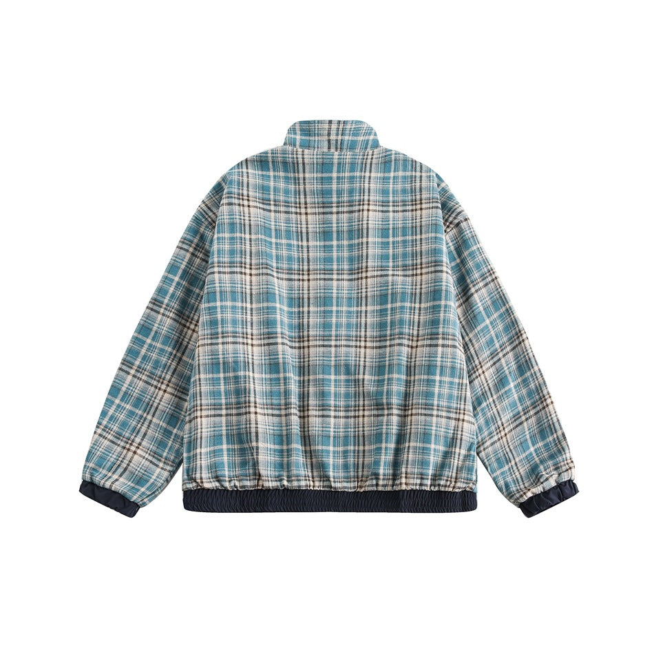 Back view of the teal and cream plaid reverse side with stand collar, navy elastic hem band and navy cuffs