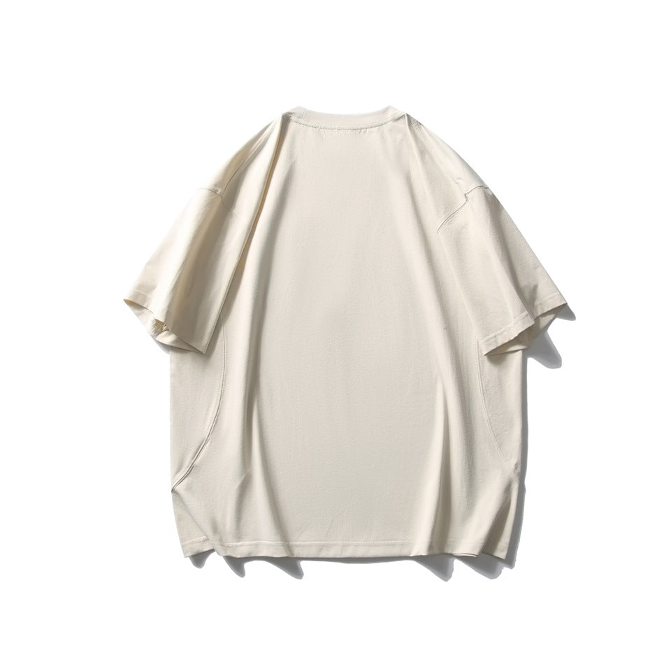 Back view of an oversized cream T-shirt with short sleeves on a white background.