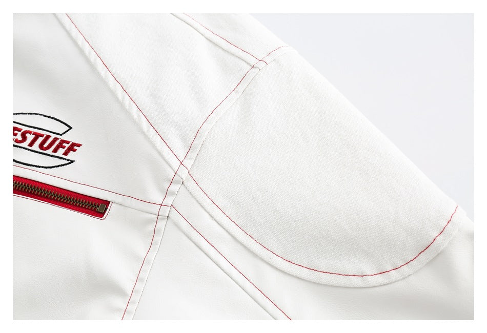 Close-up of the jacket's curved shoulder panel and red seam stitching.