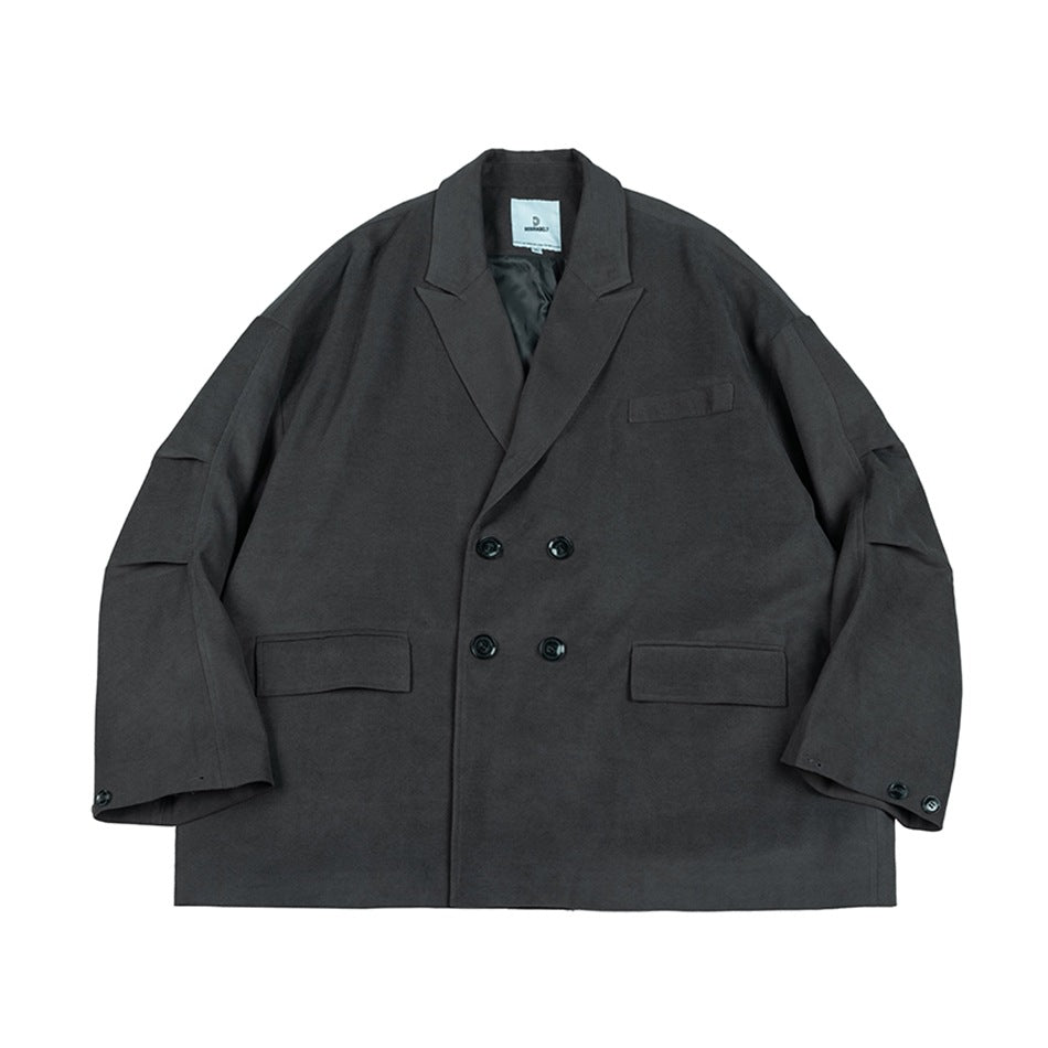 Gray double-breasted blazer-style jacket flat lay with peak lapels, four buttons and flap pockets