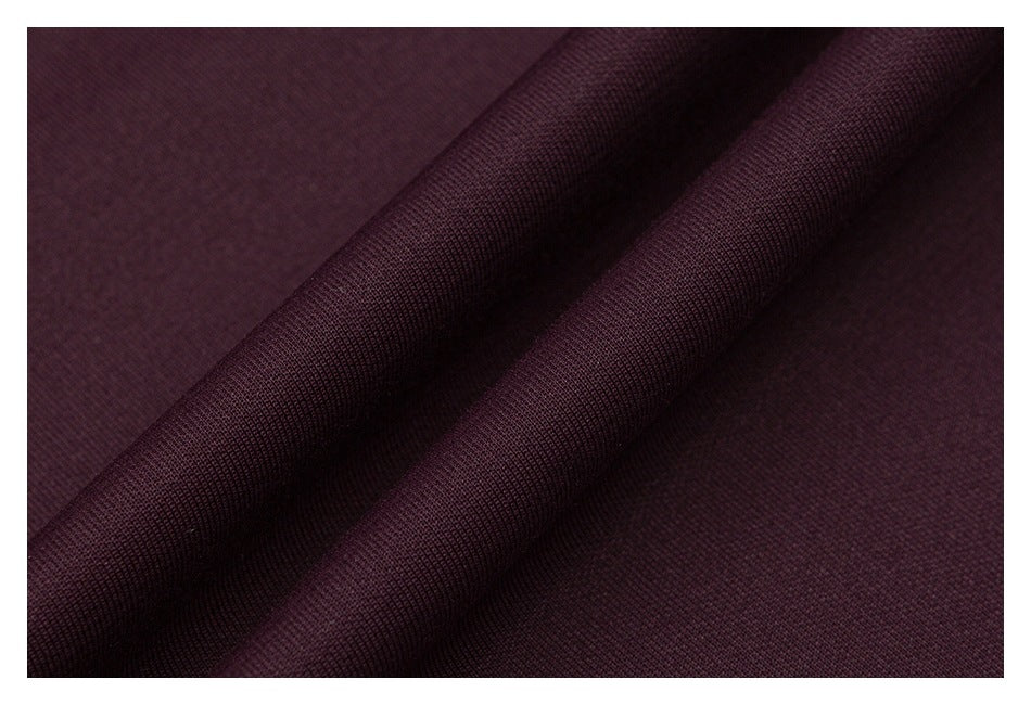 Close-up showing the dark burgundy T-shirt fabric surface and folds.